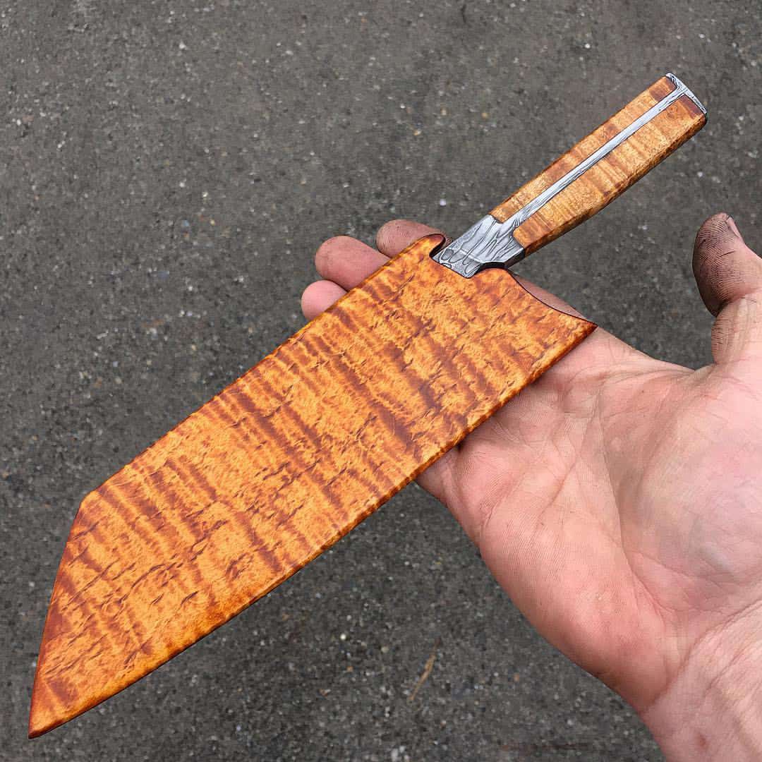 A curly maple saya covering an eight-inch blade. Photo by Nick Anger