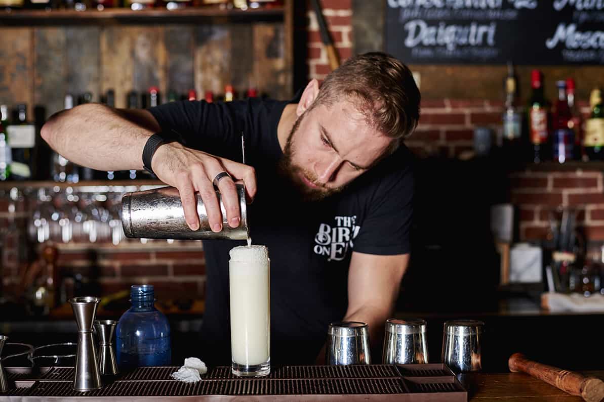 Birch on Elm: Joel Soucy pours a Ramos Gin Fizz. Photo by Dominic Perri